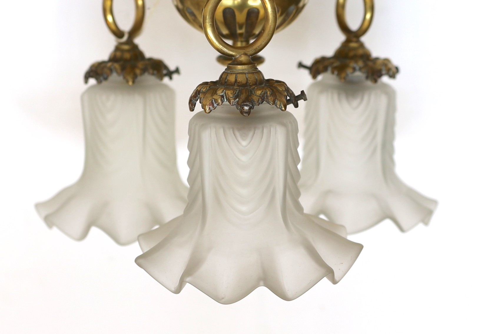 A 1920s French bronze ceiling light with three frosted glass shades, height 20cm. width 32cm